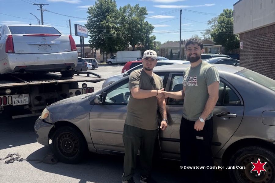 Toyota Corolla collected beside our flatbed tow truck